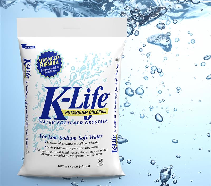 The front of a bag of K-Life in front of water splash.