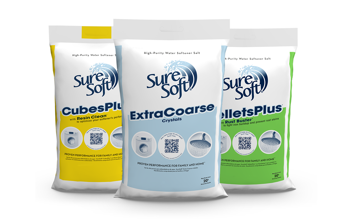 A bag of SureSoft CubesPlus with Resin Clean water softener salt, a bag of SureSoft Extra Coarse water softener salt, and a bag of SureSoft PelletsPlus with Rust Buster water softener salt.